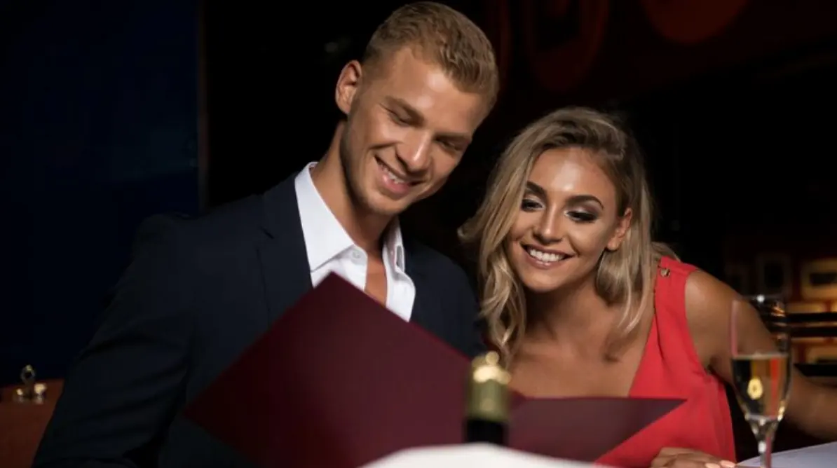 Couple seated together in a stylish evening setting